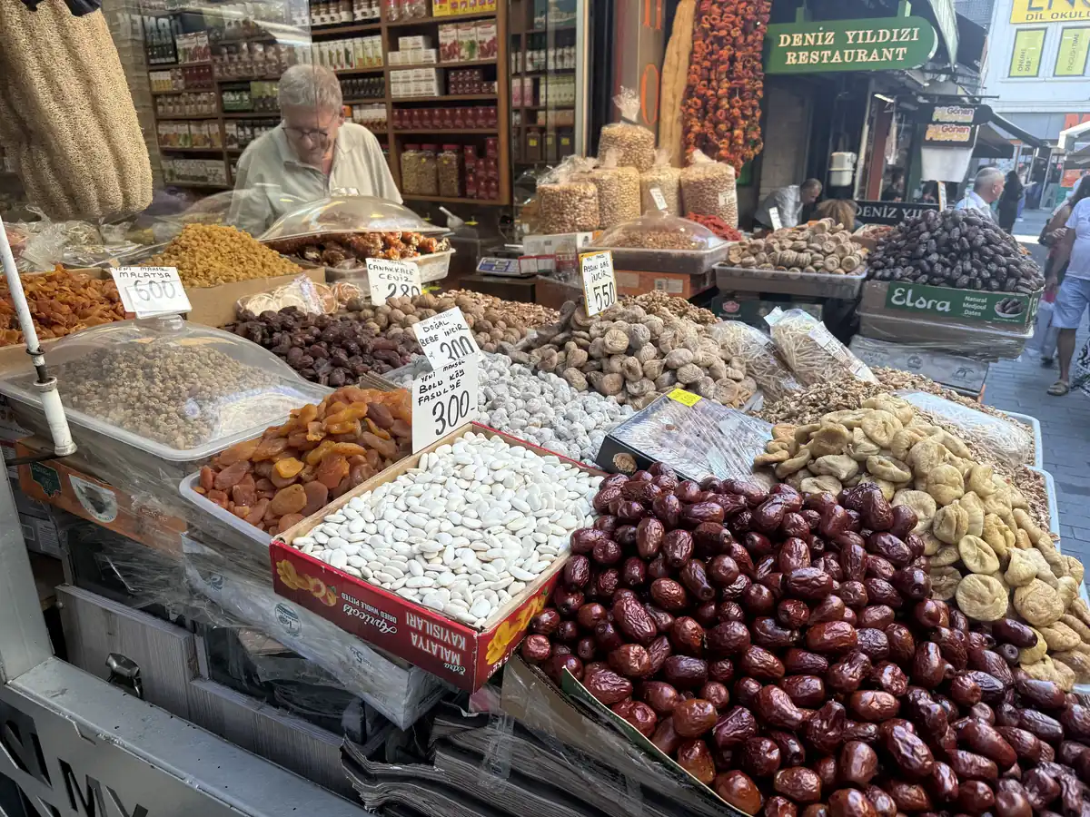 Dried fruit and nut stall piled with dates, figs and pistachios in Kadıköy Market