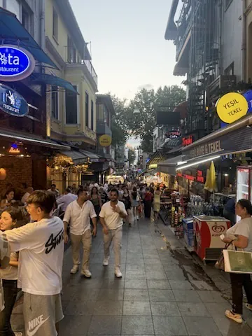 Evening crowd strolling through the pedestrian streets of Kadıköy bazaar, Istanbul