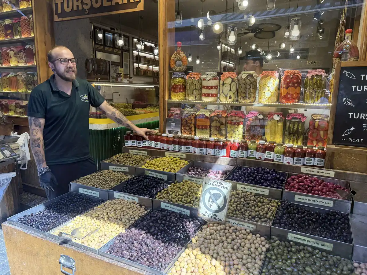 Towering jars of colourful turşu pickles and pickle juice at a traditional pickle shop in Kadıköy Market, Istanbul
