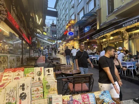 Kadıköy Market street lined with stalls and restaurants under a Kadıköy sign